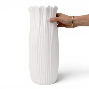 Hand holding the Tall Marissa White Vase to show its scale, vertical fluting and frilled rim